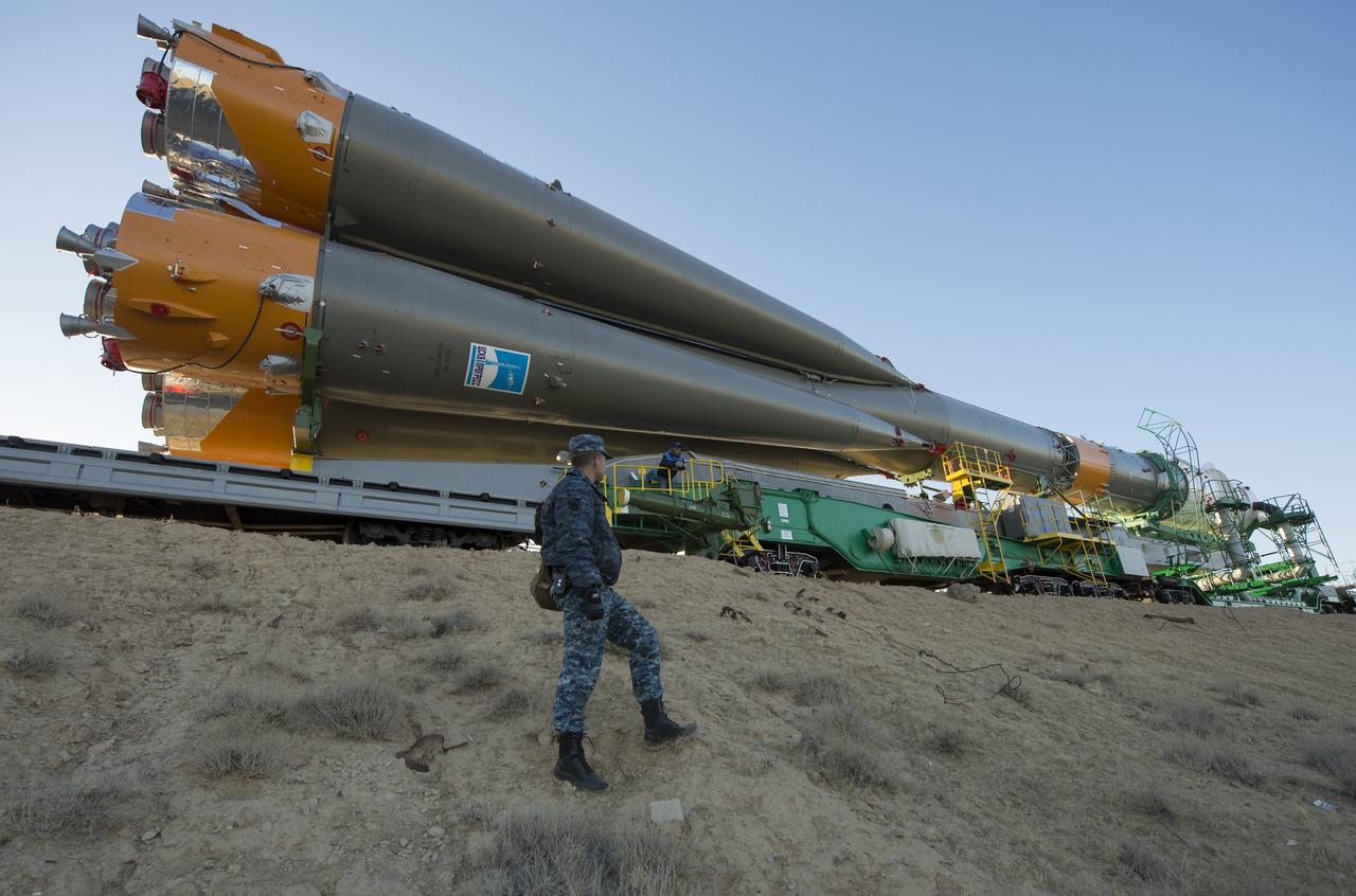 The Soyuz rocket is rolled out to the launch pad by train on Monday, Sept. 23, 2013, at the Baikonur Cosmodrome in Kazakhstan. Launch of the Soyuz rocket is scheduled for September 26 and will send Expedition 37 Soyuz Commander Oleg Kotov, NASA Flight Engineer Michael Hopkins and Russian Flight Engineer Sergei Ryazansky on a five and a half-month mission aboard the International Space Station.  Photo Credit: (NASA/Carla Cioffi)