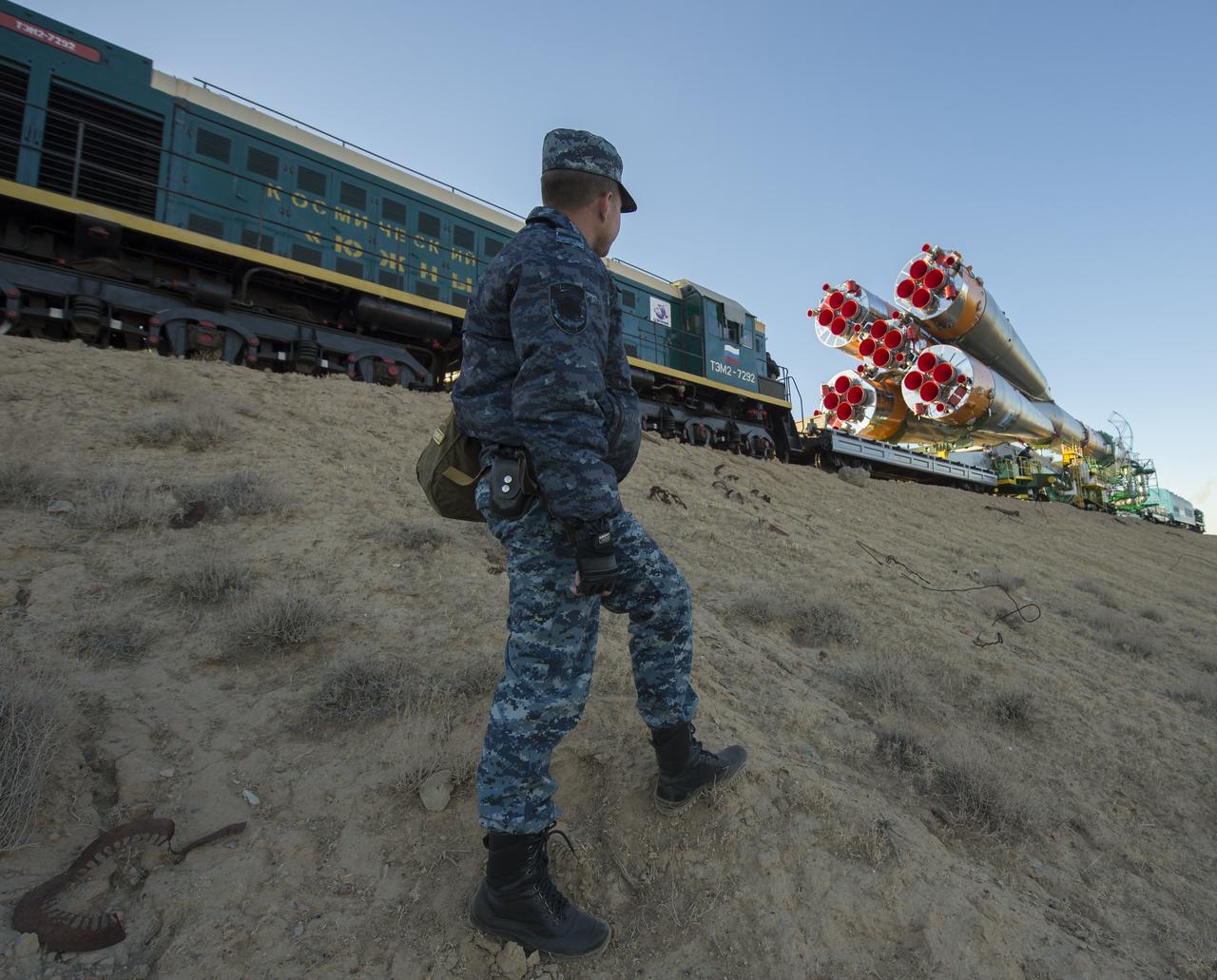 The Soyuz rocket is rolled out to the launch pad by train on Monday, Sept. 23, 2013, at the Baikonur Cosmodrome in Kazakhstan. Launch of the Soyuz rocket is scheduled for September 26 and will send Expedition 37 Soyuz Commander Oleg Kotov, NASA Flight Engineer Michael Hopkins and Russian Flight Engineer Sergei Ryazansky on a five and a half-month mission aboard the International Space Station.  Photo Credit: (NASA/Carla Cioffi)