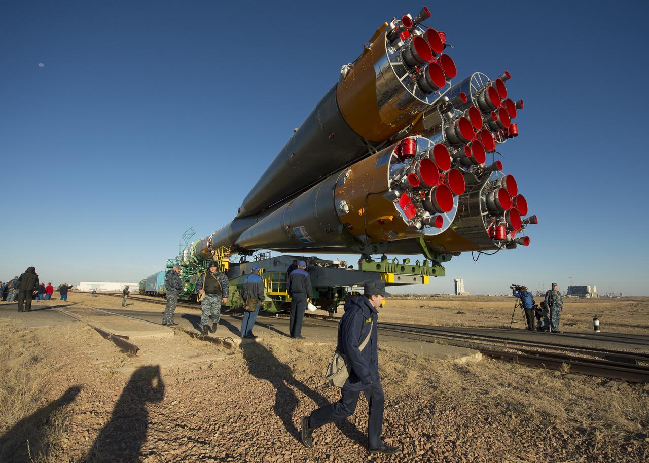 The Soyuz rocket is rolled out to the launch pad by train on Monday, Sept. 23, 2013, at the Baikonur Cosmodrome in Kazakhstan. Launch of the Soyuz rocket is scheduled for September 26 and will send Expedition 37 Soyuz Commander Oleg Kotov, NASA Flight Engineer Michael Hopkins and Russian Flight Engineer Sergei Ryazansky on a five and a half-month mission aboard the International Space Station.  Photo Credit: (NASA/Carla Cioffi)