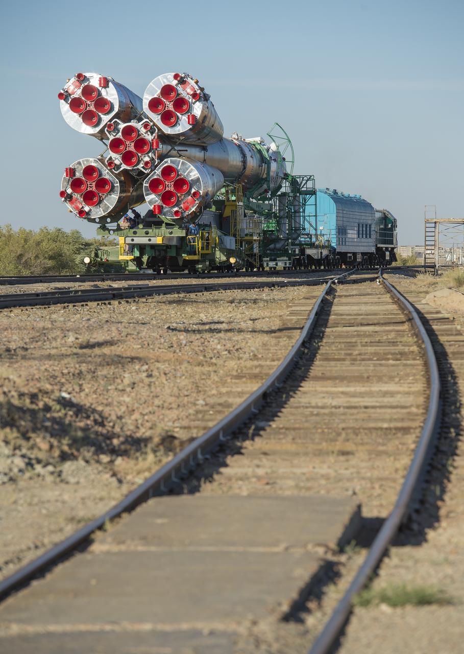 The Soyuz rocket is rolled out to the launch pad by train on Monday, Sept. 23, 2013, at the Baikonur Cosmodrome in Kazakhstan. Launch of the Soyuz rocket is scheduled for September 26 and will send Expedition 37 Soyuz Commander Oleg Kotov, NASA Flight Engineer Michael Hopkins and Russian Flight Engineer Sergei Ryazansky on a five and a half-month mission aboard the International Space Station.  Photo Credit: (NASA/Carla Cioffi)
