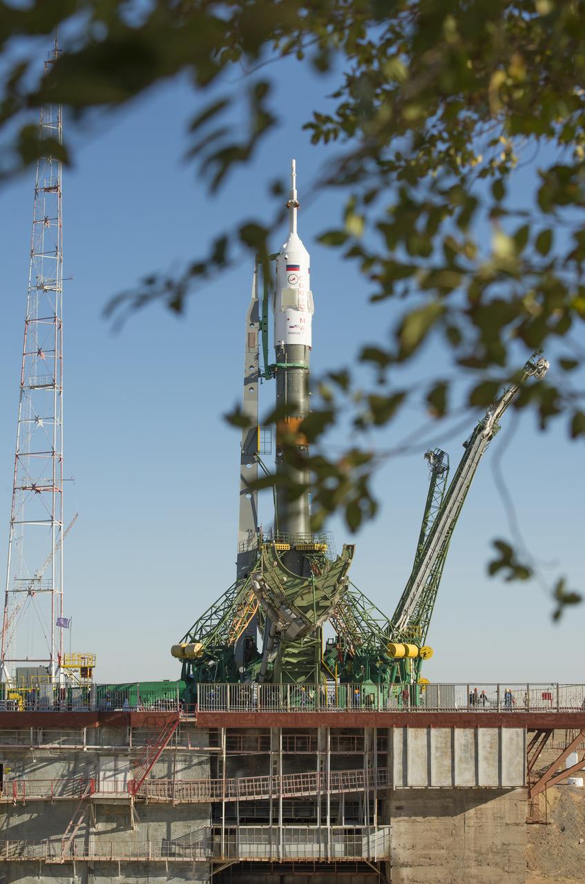 The Soyuz rocket is seen on its launch pad shortly after being lifted into its upright position on Monday, Sept. 23, 2013, at the Baikonur Cosmodrome in Kazakhstan. Launch of the Soyuz rocket is scheduled for September 26 and will send Expedition 37 Soyuz Commander Oleg Kotov, NASA Flight Engineer Michael Hopkins and Russian Flight Engineer Sergei Ryazansky on a five and a half-month mission aboard the International Space Station.  Photo Credit: (NASA/Carla Cioffi)