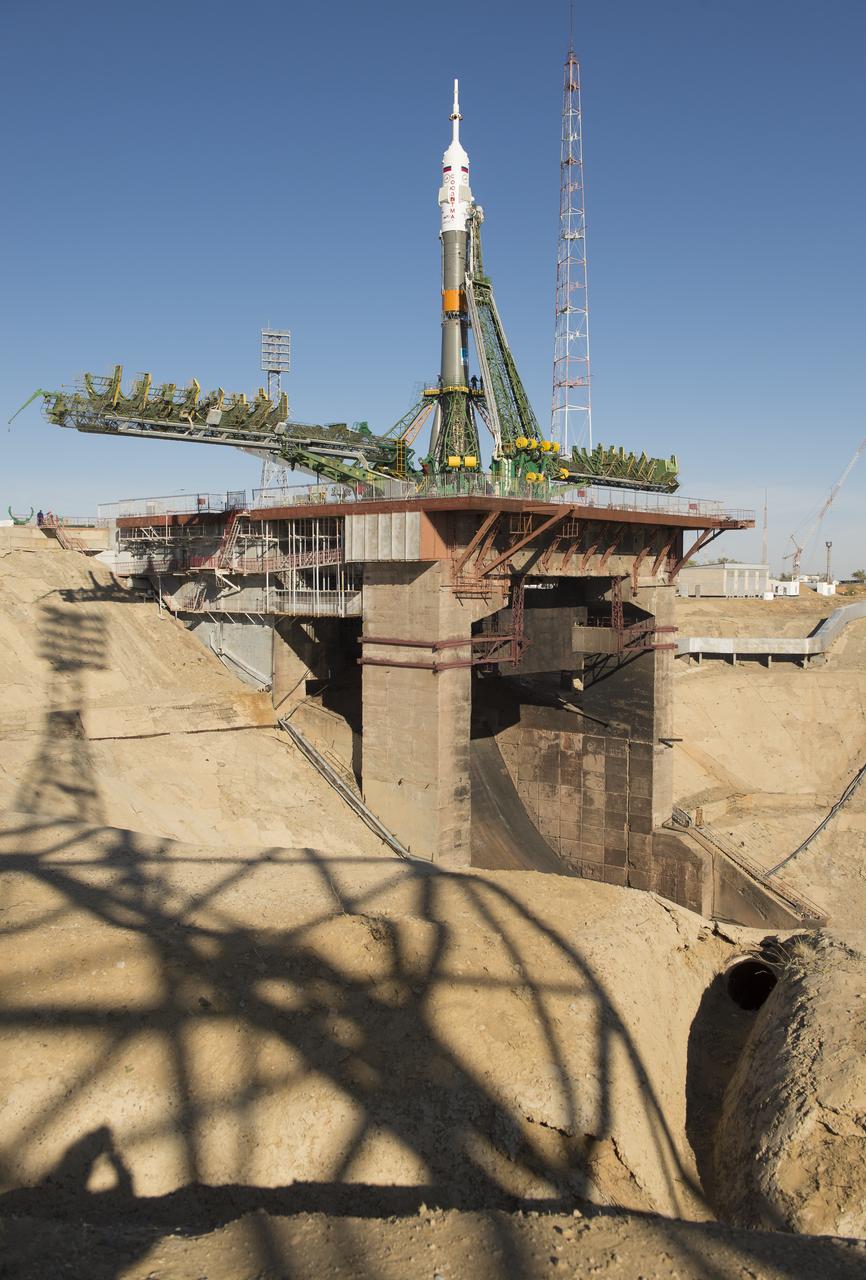 The Soyuz rocket is seen on its launch pad shortly after being lifted into its upright position on Monday, Sept. 23, 2013, at the Baikonur Cosmodrome in Kazakhstan. Launch of the Soyuz rocket is scheduled for September 26 and will send Expedition 37 Soyuz Commander Oleg Kotov, NASA Flight Engineer Michael Hopkins and Russian Flight Engineer Sergei Ryazansky on a five and a half-month mission aboard the International Space Station.  Photo Credit: (NASA/Carla Cioffi)