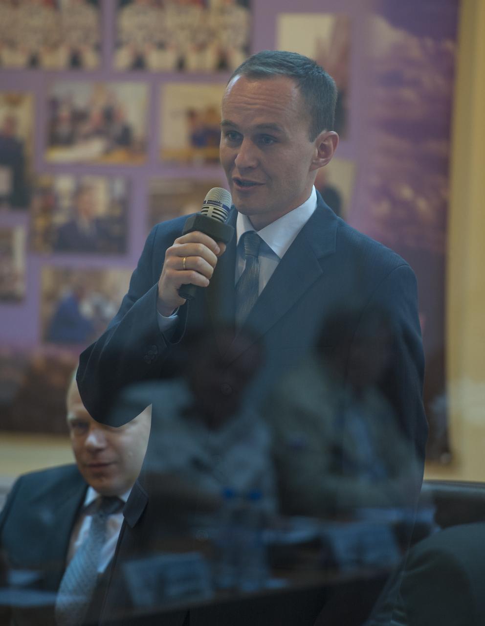 Expedition 37 Russian Flight Engineer Sergey Ryazanskiy of the Russian Federal Space Agency (Roscosmos) talks during the State Commission meeting at the Cosmonaut Hotel, Tuesday, Sept. 24, 2013, in Kazakhstan. Launch of the Soyuz rocket is scheduled for September 26 and will send Ryazanskiy, Soyuz Commander Oleg Kotov and NASA Flight Engineer Michael Hopkins on a five and a half-month mission aboard the International Space Station.  Photo Credit: (NASA/Carla Cioffi)
