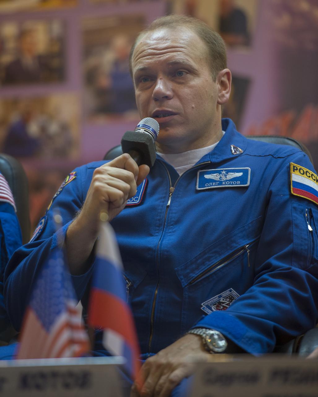 Expedition 37 Soyuz Commander Oleg Kotov answers  a reporter’s question at a press conference held at the Cosmonaut Hotel, on Tuesday, Sept. 24, 2013, in Baikonur, Kazakhstan. Launch of the Soyuz rocket is scheduled for September 26 and will send Kotov, NASA Flight Engineer Michael Hopkins and Russian Flight Engineer Sergei Ryazansky on a five and a half-month mission aboard the International Space Station.  Photo Credit: (NASA/Carla Cioffi)