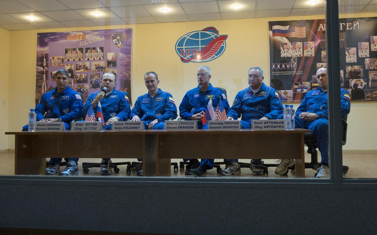 Expedition 37 NASA Flight Engineer Michael Hopkins, far left, Soyuz Commander Oleg Kotov, Russian Flight Engineer Sergey Ryazanskiy, backup crewmembers Steve Swanson of NASA, Alexander Skvortsov of Russia and Oleg Artemyev of Russia, far right, are seen at a press conference held at the Cosmonaut Hotel, on Tuesday, Sept. 24, 2013, in Baikonur, Kazakhstan.  Photo Credit: (NASA/Carla Cioffi)