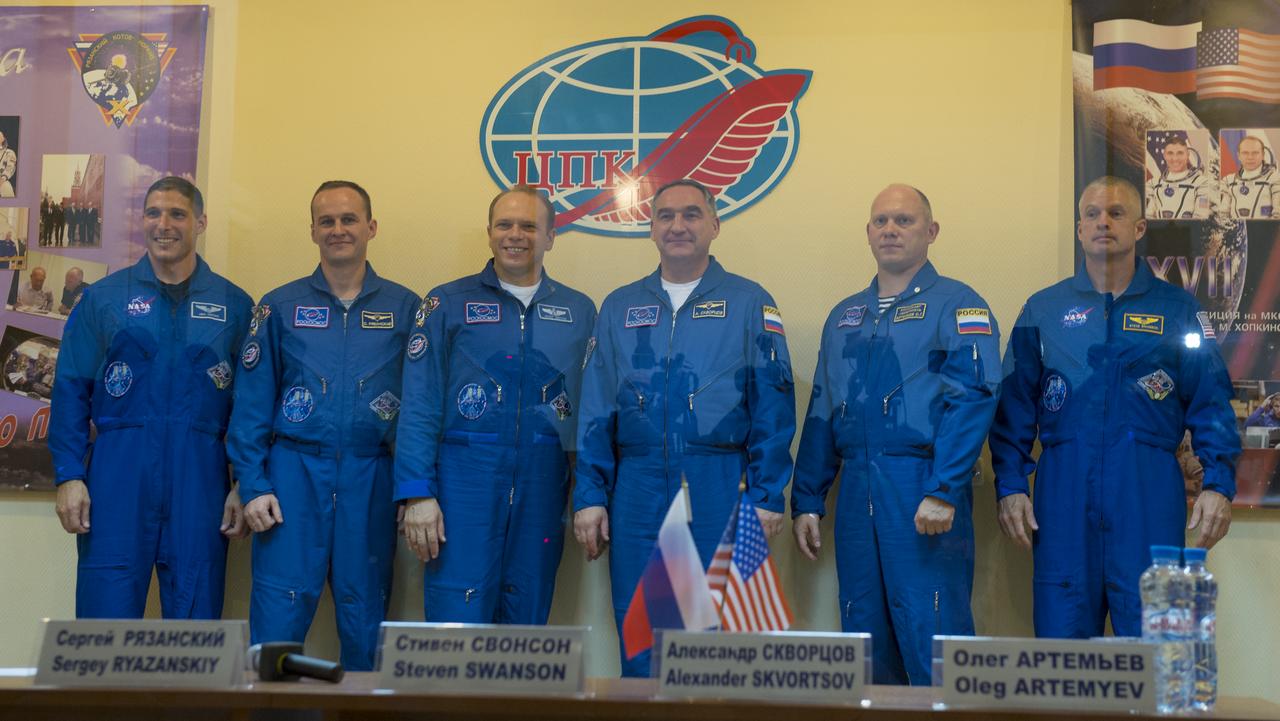 Expedition 37 NASA Flight Engineer Michael Hopkins, far left, Soyuz Commander Oleg Kotov, Russian Flight Engineer Sergey Ryazanskiy, backup crewmembers Steve Swanson of NASA, Alexander Skvortsov of Russia and Oleg Artemyev of Russia, far right, are seen posing for a photo following a press conference held at the Cosmonaut Hotel, on Tuesday, Sept. 24, 2013, in Baikonur, Kazakhstan.  Photo Credit: (NASA/Carla Cioffi)