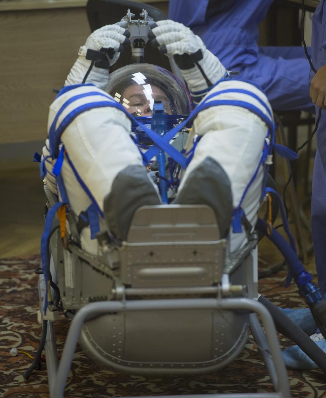 Expedition 37/38 Russian Flight Engineer Sergey Ryazanskiy has his Russian Sokol suit pressure checked ahead of his launch onboard a Soyuz TMA-10M spacecraft to the International Space Station with fellow crewmates NASA Flight Engineer Michael Hopkins and Soyuz Commander Oleg Kotov, on Wednesday, Sept. 25, 2013, in Baikonur, Kazakhstan. Launch of the Soyuz rocket will send the Expedition 37/38 crewmates on a five-month mission aboard the International Space Station.  Photo Credit: (NASA/Carla Cioffi)