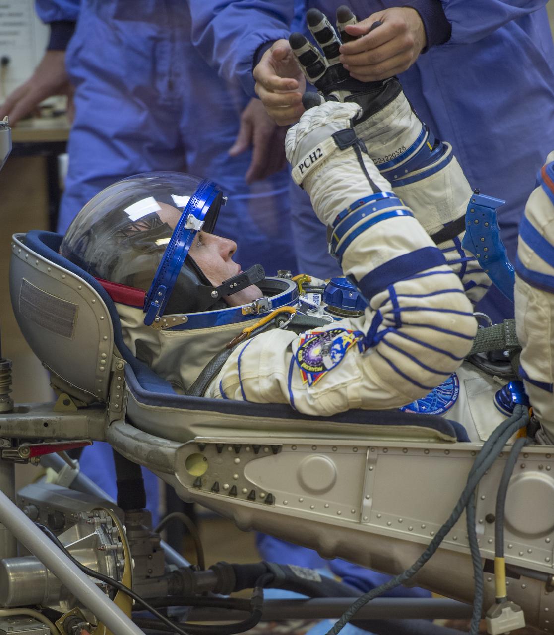 Expedition 37/38 Russian Flight Engineer Sergey Ryazanskiy has his Russian Sokol suit pressure checked ahead of his launch onboard a Soyuz TMA-10M spacecraft to the International Space Station with fellow crewmates NASA Flight Engineer Michael Hopkins and Soyuz Commander Oleg Kotov, on Wednesday, Sept. 25, 2013, in Baikonur, Kazakhstan. Launch of the Soyuz rocket will send the Expedition 37/38 crewmates on a five-month mission aboard the International Space Station.  Photo Credit: (NASA/Carla Cioffi)