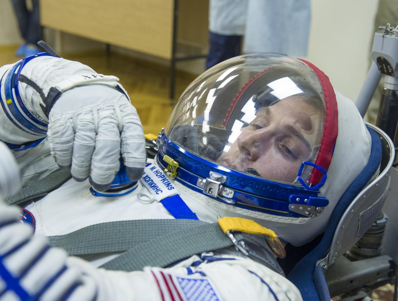 Expedition 37/38 NASA   Engineer Michael Hopkins has his Russian Sokol suit pressure checked ahead of his launch onboard a Soyuz TMA-10M spacecraft to the International Space Station with fellow crewmates Russian Flight Engineer Sergey Ryazanskiy and Soyuz Commander Oleg Kotov, on Wednesday, Sept. 25, 2013, in Baikonur, Kazakhstan. Launch of the Soyuz rocket will send the crewmates on a five-month mission aboard the International Space Station.  Photo Credit: (NASA/GCTC/Andrey Shelepin)