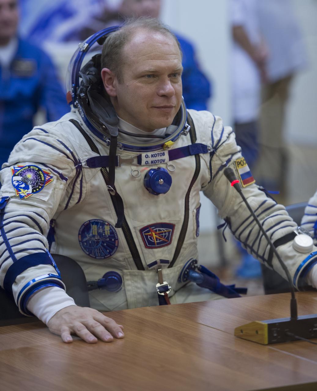 Expedition 37/38 Soyuz Commander Oleg Kotov smiles after having his Russian Sokol suit pressure checked ahead of his launch onboard a Soyuz TMA-10M spacecraft to the International Space Station, on Wednesday, Sept. 25, 2013, in Baikonur, Kazakhstan. Launch of the Soyuz rocket will send the Expedition 37/38 crewmates on a five-month mission aboard the International Space Station.  Photo Credit: (NASA/Carla Cioffi)
