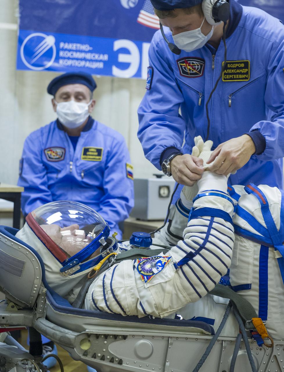Expedition 37/38 Soyuz Commander Oleg Kotov has his Russian Sokol suit pressure checked ahead of his launch onboard a Soyuz TMA-10M spacecraft to the International Space Station with fellow crewmates Russian Flight Engineer Sergey Ryazanskiy and NASA Engineer Michael Hopkins, on Wednesday, Sept. 25, 2013, in Baikonur, Kazakhstan. Launch of the Soyuz rocket will send the crewmates on a five-month mission aboard the International Space Station.  Photo Credit: (NASA/GCTC/Andrey Shelepin)