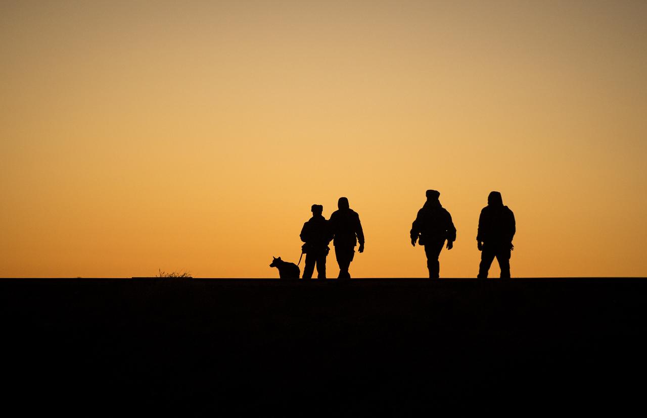 Police walk along railroad tracks, along with a bomb sniffing dog, ahead of the roll out of the Soyuz TMA-11M rocket to the launch pad on Tuesday, Nov. 5, 2013, at the Baikonur Cosmodrome in Kazakhstan. Launch of the Soyuz rocket is scheduled for November 7 and will send Expedition 38 Soyuz Commander Mikhail Tyurin of Roscosmos, Flight Engineer Rick Mastracchio of NASA and Flight Engineer Koichi Wakata of the Japan Aerospace Exploration Agency on a six-month mission aboard the International Space Station. Photo Credit: (NASA/Bill Ingalls)