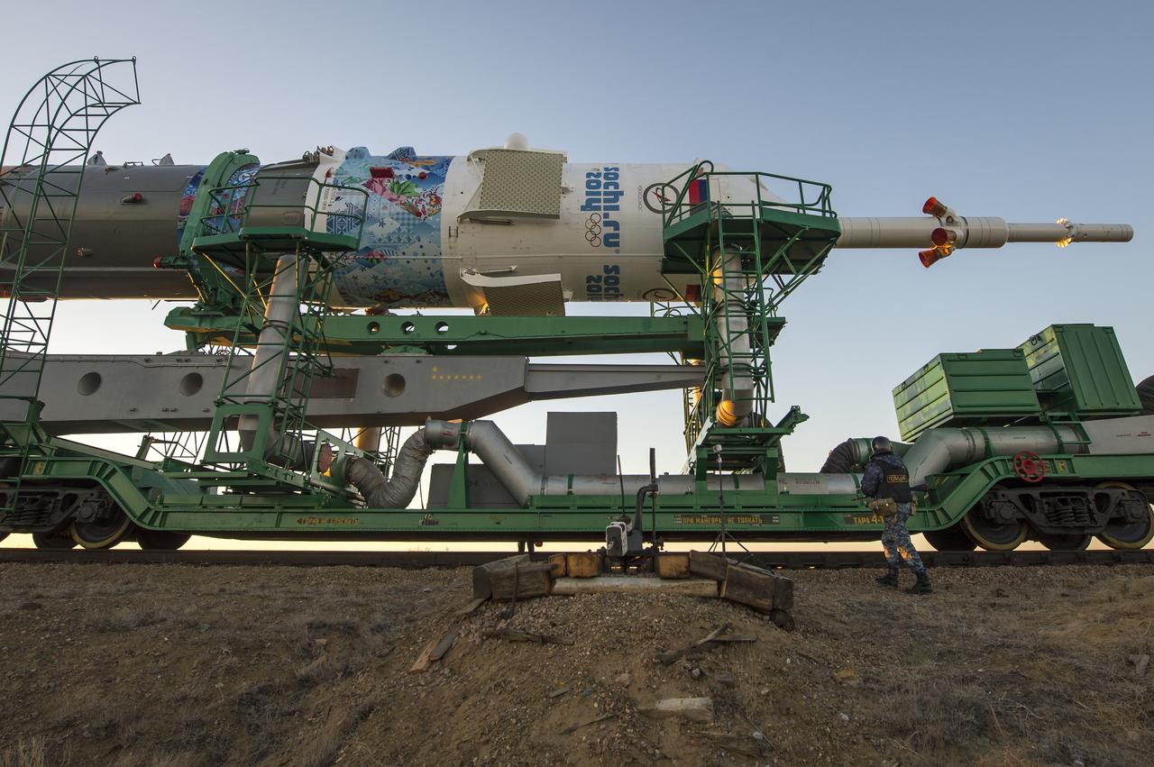 The Soyuz TMA-11M rocket, adorned with the logo of the Sochi Olympic Organizing Committee and other related artwork, is rolled out to the launch pad by train on Tuesday, Nov. 5, 2013, at the Baikonur Cosmodrome in Kazakhstan. Launch of the Soyuz rocket is scheduled for November 7 and will send Expedition 38 Soyuz Commander Mikhail Tyurin of Roscosmos, Flight Engineer Rick Mastracchio of NASA and Flight Engineer Koichi Wakata of the Japan Aerospace Exploration Agency on a six-month mission aboard the International Space Station.  Photo Credit: (NASA/Bill Ingalls)