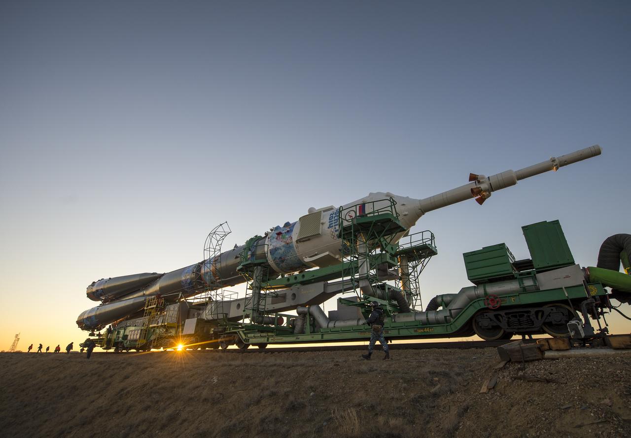 The Soyuz TMA-11M rocket, adorned with the logo of the Sochi Olympic Organizing Committee and other related artwork, is rolled out to the launch pad by train on Tuesday, Nov. 5, 2013, at the Baikonur Cosmodrome in Kazakhstan. Launch of the Soyuz rocket is scheduled for November 7 and will send Expedition 38 Soyuz Commander Mikhail Tyurin of Roscosmos, Flight Engineer Rick Mastracchio of NASA and Flight Engineer Koichi Wakata of the Japan Aerospace Exploration Agency on a six-month mission aboard the International Space Station.  Photo Credit: (NASA/Bill Ingalls)