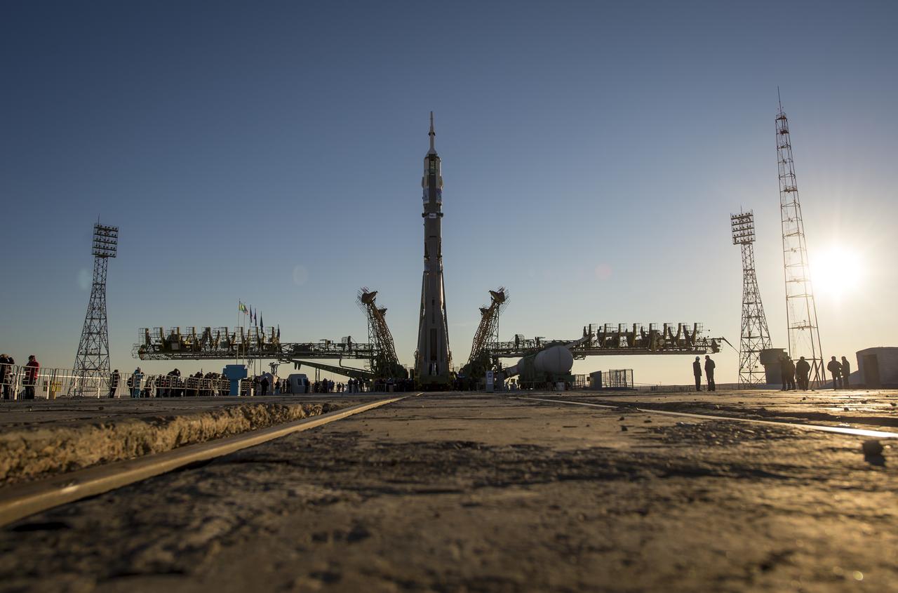 The Soyuz TMA-11M rocket is erected into position after being rolled out to the launch pad by train on Tuesday, Nov. 5, 2013, at the Baikonur Cosmodrome in Kazakhstan. Launch of the Soyuz rocket is scheduled for November 7 and will send Expedition 38 Soyuz Commander Mikhail Tyurin of Roscosmos, Flight Engineer Rick Mastracchio of NASA and Flight Engineer Koichi Wakata of the Japan Aerospace Exploration Agency on a six-month mission aboard the International Space Station.  Photo Credit: (NASA/Bill Ingalls)