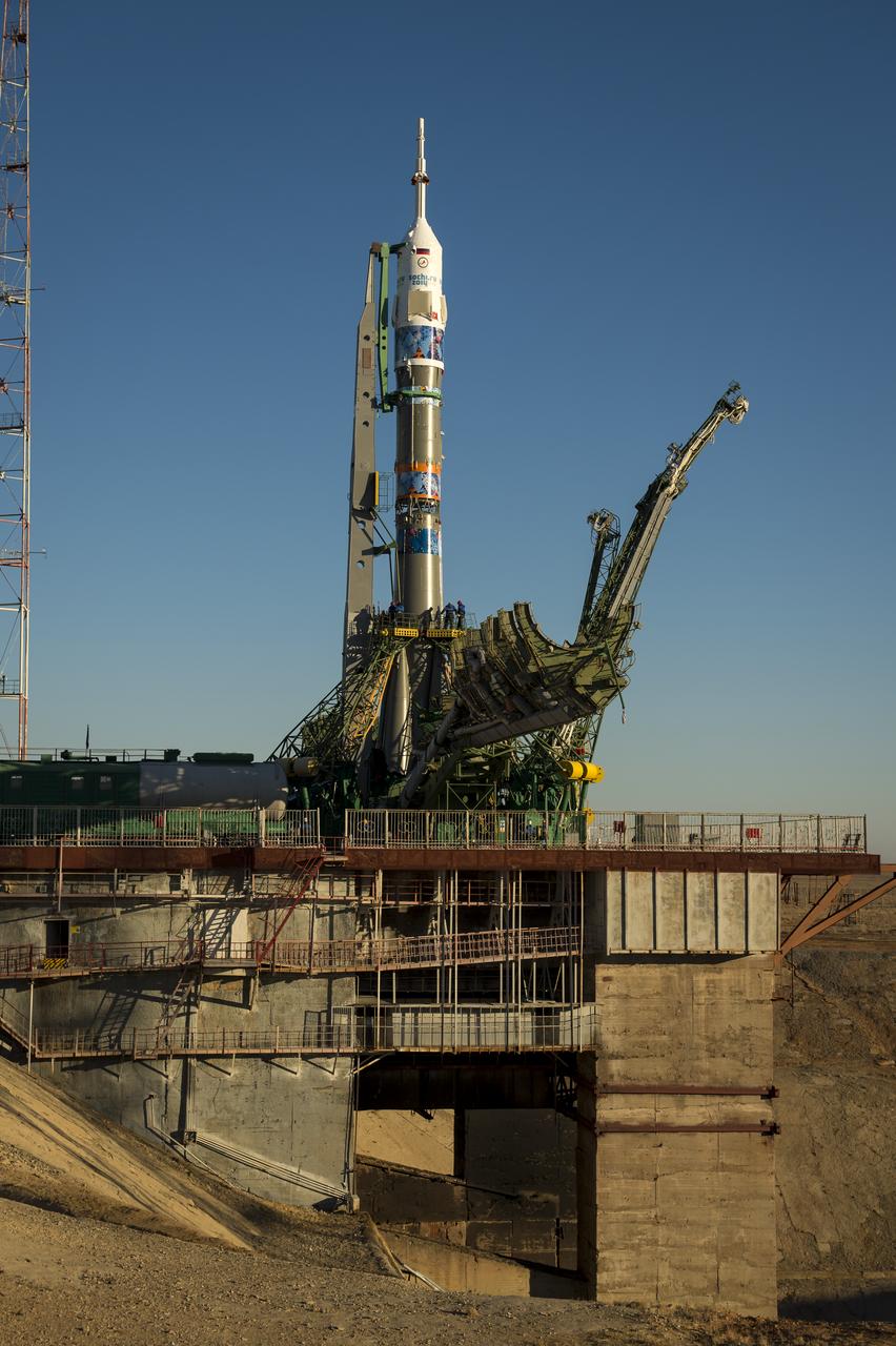 The Soyuz TMA-11M rocket, adorned with the logo of the Sochi Olympic Organizing Committee and other related artwork, is seen after being erected into position at the launch pad on Tuesday, Nov. 5, 2013, at the Baikonur Cosmodrome in Kazakhstan. Launch of the Soyuz rocket is scheduled for November 7 and will send Expedition 38 Soyuz Commander Mikhail Tyurin of Roscosmos, Flight Engineer Rick Mastracchio of NASA and Flight Engineer Koichi Wakata of the Japan Aerospace Exploration Agency on a six-month mission aboard the International Space Station.  Photo Credit: (NASA/Bill Ingalls)