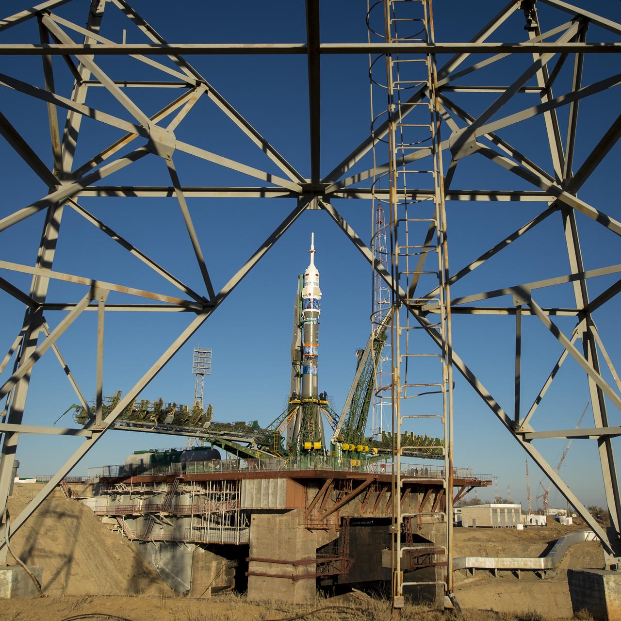 The Soyuz TMA-11M rocket, adorned with the logo of the Sochi Olympic Organizing Committee and other related artwork, is seen after being erected into position at the launch pad on Tuesday, Nov. 5, 2013, at the Baikonur Cosmodrome in Kazakhstan. Launch of the Soyuz rocket is scheduled for November 7 and will send Expedition 38 Soyuz Commander Mikhail Tyurin of Roscosmos, Flight Engineer Rick Mastracchio of NASA and Flight Engineer Koichi Wakata of the Japan Aerospace Exploration Agency on a six-month mission aboard the International Space Station.  Photo Credit: (NASA/Bill Ingalls)