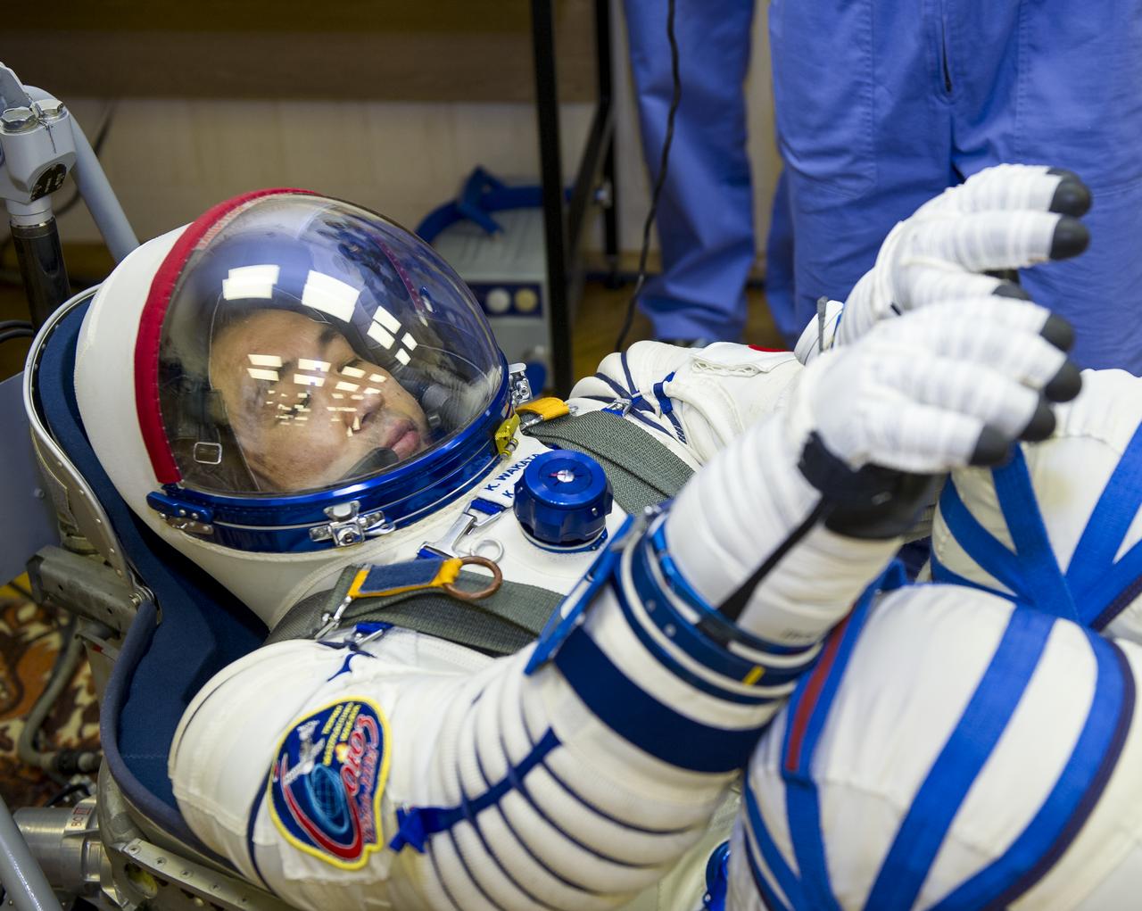 Expedition 38 Flight Engineer Koichi Wakata of the Japan Aerospace Exploration Agency is seen laying in a seat liner as he and fellow crew mates, Soyuz Commander Mikhail Tyurin of Roscosmos, and, Flight Engineer Rick Mastracchio of NASA, have their Russian Sokol suits pressure checked a few hours ahead of their launch, Thursday, Nov. 7, 2013, in Baikonur, Kazakhstan. Tyurin, Wakata, and, Mastracchio will launch in their Soyuz TMA-11M spacecraft to the International Space Station to begin a six-month mission. Photo Credit: (NASA/GCTC/Irina Peshkova)