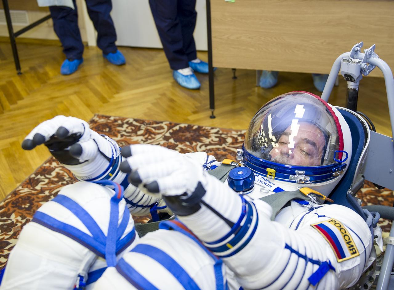 Expedition 38 Soyuz Commander Mikhail Tyurin of Roscosmos is seen laying in a seat liner as he and fellow crew mates, Flight Engineer Koichi Wakata of the Japan Aerospace Exploration Agency, and, Flight Engineer Rick Mastracchio of NASA, have their Russian Sokol suits pressure checked a few hours ahead of their launch, Thursday, Nov. 7, 2013, in Baikonur, Kazakhstan. Tyurin, Wakata, and, Mastracchio will launch in their Soyuz TMA-11M spacecraft to the International Space Station to begin a six-month mission. Photo Credit: (NASA/GCTC/Irina Peshkova)