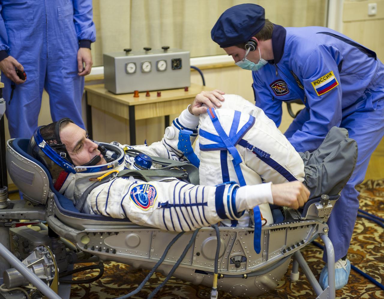 Expedition 38 Flight Engineer Rick Mastracchio of NASA is seen laying in a seat liner as he and fellow crew mates, Flight Engineer Koichi Wakata of the Japan Aerospace Exploration Agency, and, Soyuz Commander Mikhail Tyurin of Roscosmos, have their Russian Sokol suits pressure checked a few hours ahead of their launch, Thursday, Nov. 7, 2013, in Baikonur, Kazakhstan. Tyurin, Wakata, and, Mastracchio will launch in their Soyuz TMA-11M spacecraft to the International Space Station to begin a six-month mission. Photo Credit: (NASA/GCTC/Irina Peshkova)