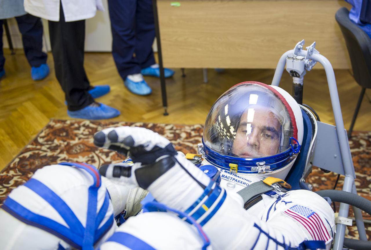 Expedition 38 Flight Engineer Rick Mastracchio of NASA is seen laying in a seat liner as he and fellow crew mates, Flight Engineer Koichi Wakata of the Japan Aerospace Exploration Agency, and, Soyuz Commander Mikhail Tyurin of Roscosmos, have their Russian Sokol suits pressure checked a few hours ahead of their launch, Thursday, Nov. 7, 2013, in Baikonur, Kazakhstan. Tyurin, Wakata, and, Mastracchio will launch in their Soyuz TMA-11M spacecraft to the International Space Station to begin a six-month mission. Photo Credit: (NASA/GCTC/Irina Peshkova)