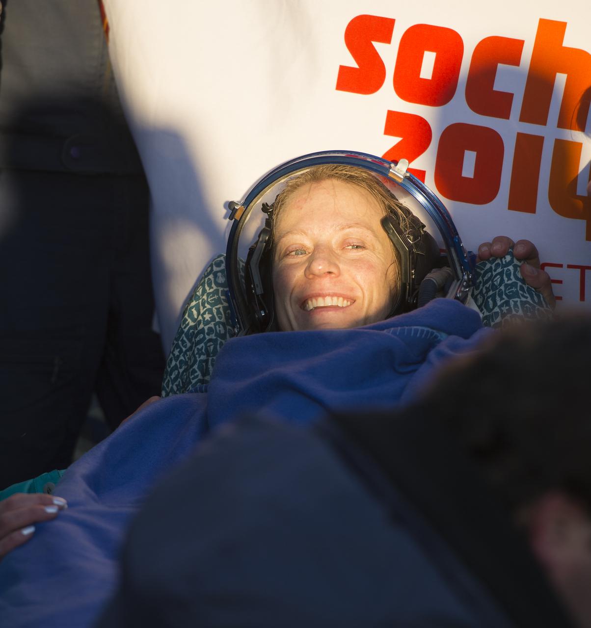 Expedition 37 NASA Flight Engineer Karen Nyberg smiles minutes after her landing in the Soyuz TMA-09M spacecraft in a remote area southeast of the town of Zhezkazgan, Kazakhstan, on Monday, Nov. 11, 2013.  Nyberg, Expedition 37 Commander Fyodor Yurchikhin of the Russian Federal Space Agency (Roscosmos) and Italian Flight Engineer Luca Parmitano returned to earth after five and a half months on the International Space Station. Photo Credit: (NASA/Carla Cioffi)