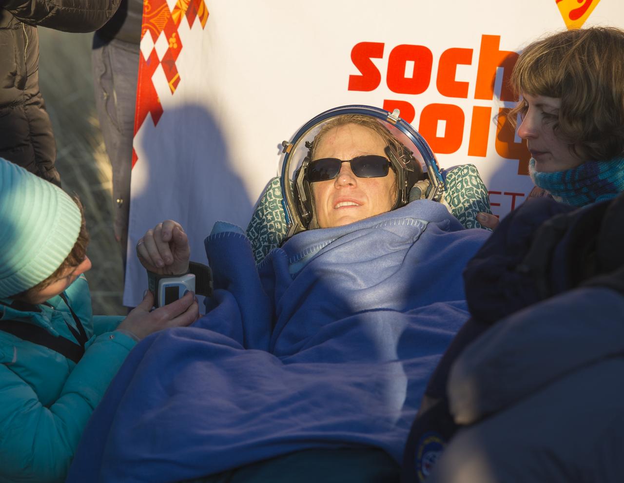 Expedition 37 NASA Flight Engineer Karen Nyberg is seen minutes after her landing in the Soyuz TMA-09M spacecraft in a remote area southeast of the town of Zhezkazgan, Kazakhstan, on Monday, Nov. 11, 2013.  Nyberg, Expedition 37 Commander Fyodor Yurchikhin of the Russian Federal Space Agency (Roscosmos) and Italian Flight Engineer Luca Parmitano returned to earth after five and a half months on the International Space Station. Photo Credit: (NASA/Carla Cioffi)