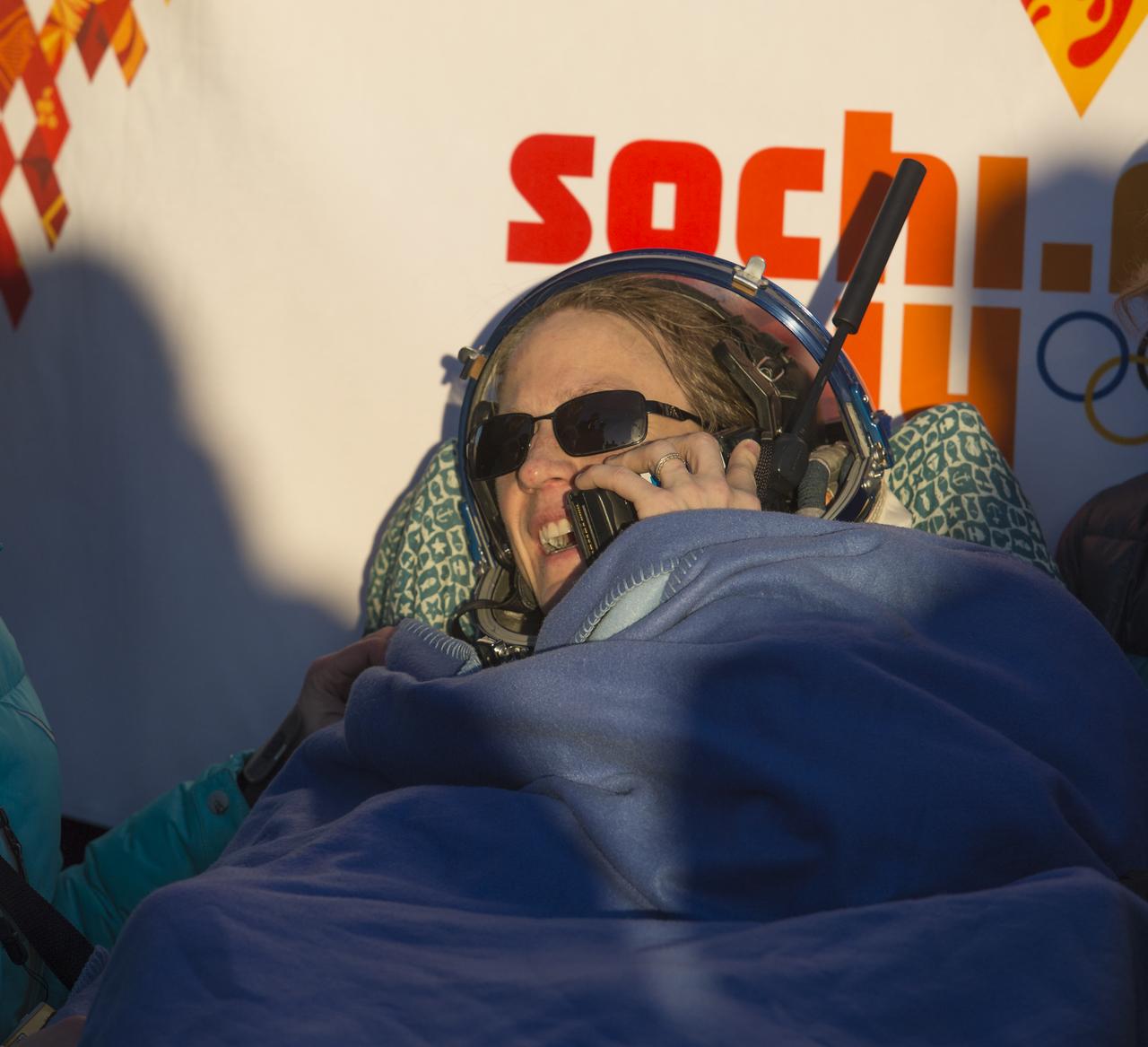 Expedition 37 NASA Flight Engineer Karen Nyberg is seen speaking to her family by satellite phone minutes after her landing in the Soyuz TMA-09M spacecraft in a remote area southeast of the town of Zhezkazgan, Kazakhstan, on Monday, Nov. 11, 2013.  Nyberg, Expedition 37 Commander Fyodor Yurchikhin of the Russian Federal Space Agency (Roscosmos) and Italian Flight Engineer Luca Parmitano returned to earth after five and a half months on the International Space Station. Photo Credit: (NASA/Carla Cioffi)