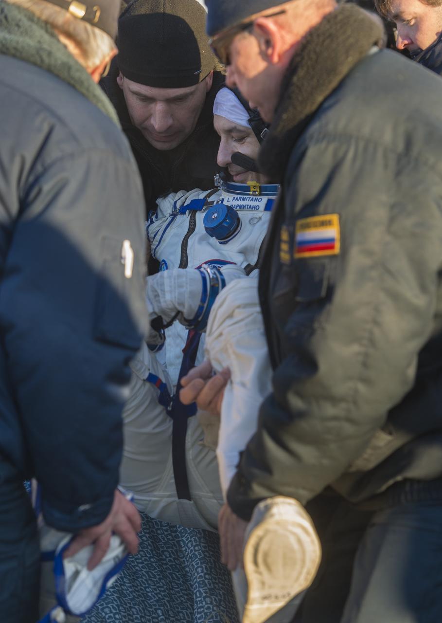 Expedition 37 Luca Parmitano of ESA (European Space Agency) is carried from the Soyuz TMA-09M spacecraft minutes after he landed in a remote area outside the town of Zhezkazgan, Kazakhstan, on Monday, Nov. 11, 2013.  Parmitano, Expedition 37 Commander Fyodor Yurchikhin of the Russian Federal Space Agency (Roscosmos) and NASA Flight Engineer Karen Nyberg returned to earth after five and a half months on the International Space Station. Photo Credit: (NASA/Carla Cioffi)