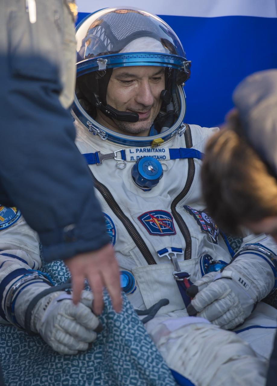 Expedition 37 Luca Parmitano of ESA (European Space Agency) is carried from the Soyuz TMA-09M spacecraft minutes after he landed in a remote area outside the town of Zhezkazgan, Kazakhstan, on Monday, Nov. 11, 2013. Parmitano, Expedition 37 Commander Fyodor Yurchikhin of the Russian Federal Space Agency (Roscosmos) and NASA Flight Engineer Karen Nyberg returned to earth after five and a half months on the International Space Station. Photo Credit: (NASA/Carla Cioffi)