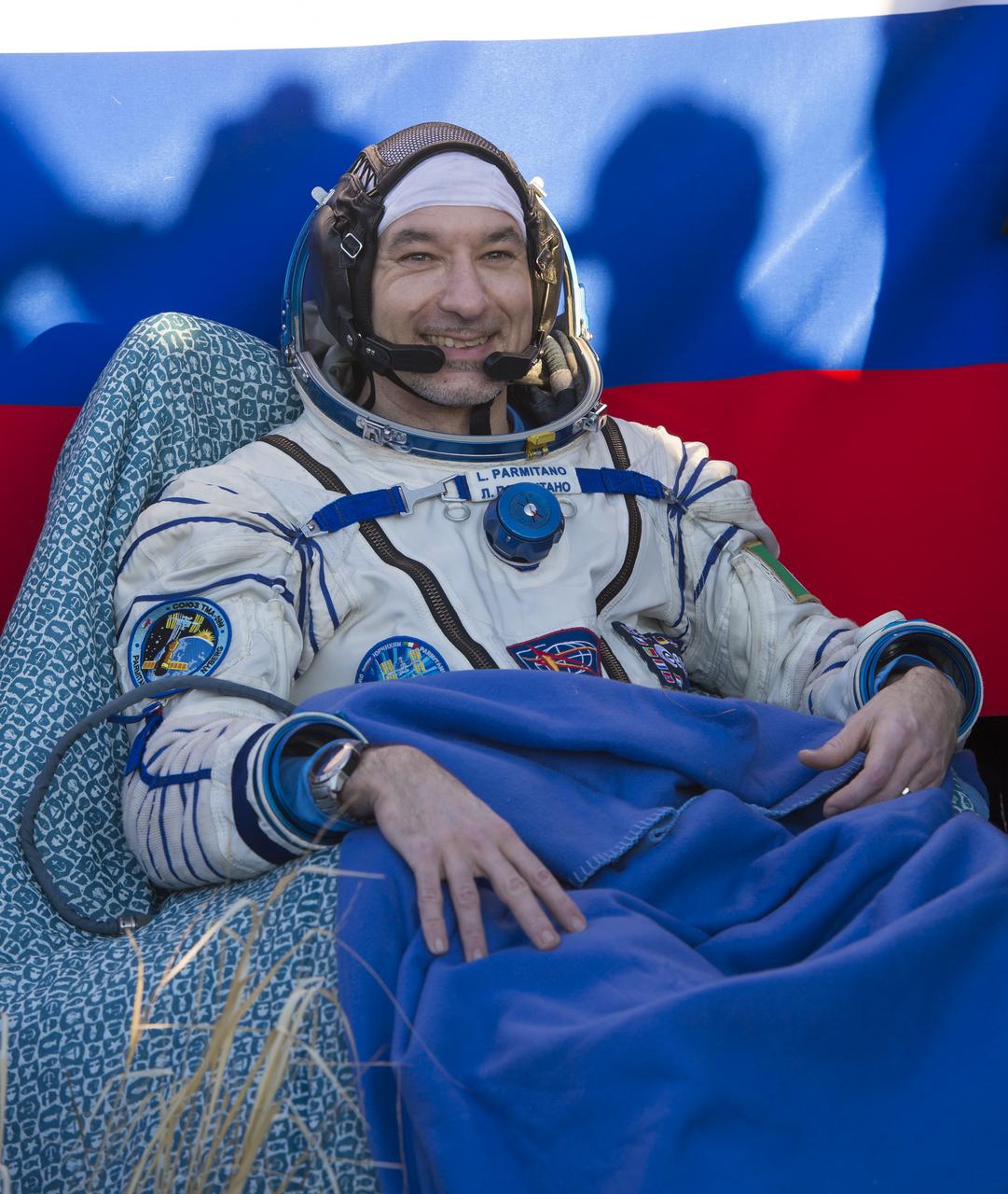 Expedition 37 Luca Parmitano of ESA (European Space Agency) smiles minutes after his landing in the Soyuz TMA-09M spacecraft in a remote area outside the town of Zhezkazgan, Kazakhstan, on Monday, Nov. 11, 2013. Parmitano, Expedition 37 Commander Fyodor Yurchikhin of the Russian Federal Space Agency (Roscosmos) and NASA Flight Engineer Karen Nyberg returned to earth after five and a half months on the International Space Station. Photo Credit: (NASA/Carla Cioffi)
