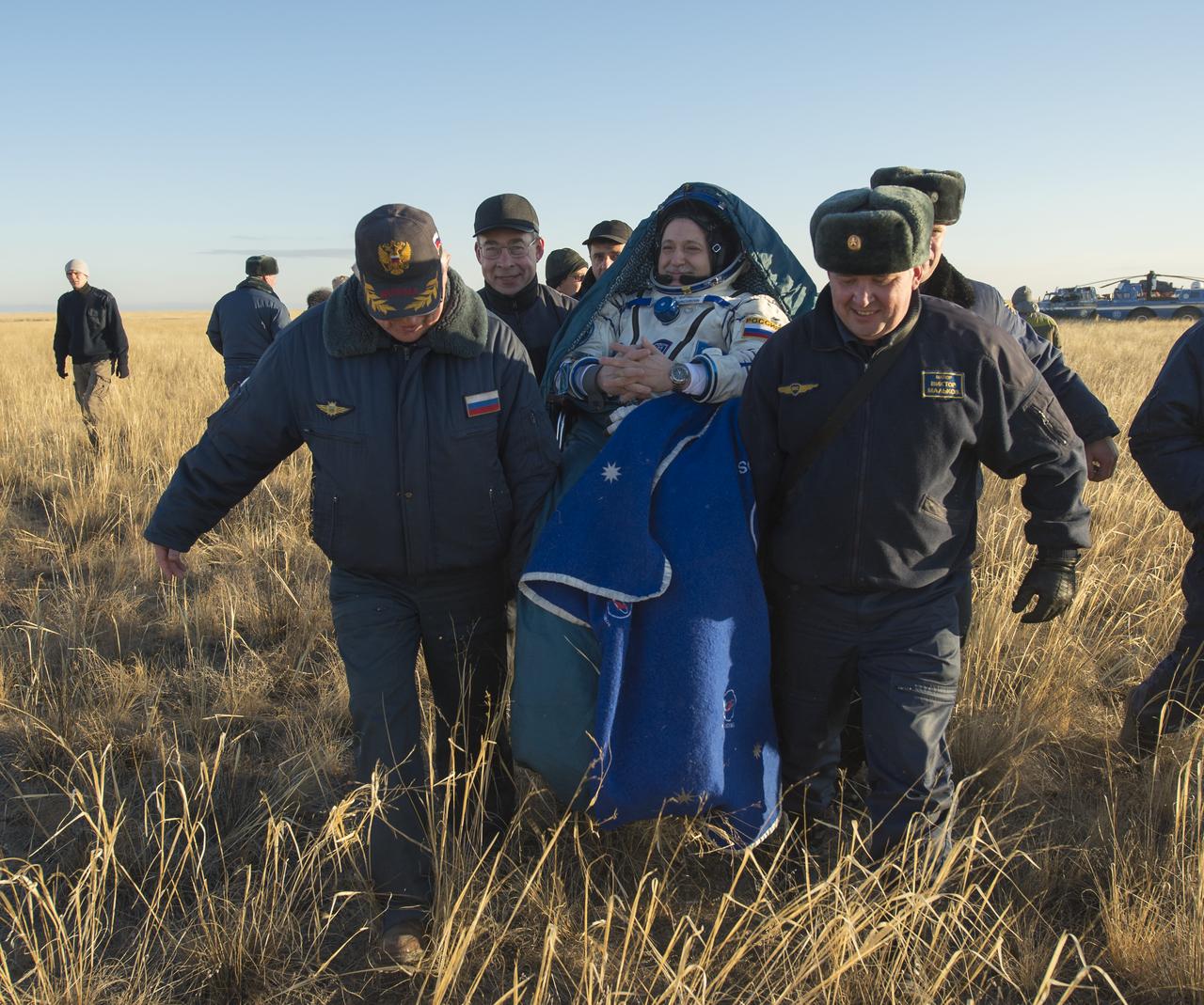 Expedition 37 Commander Fyodor Yurchikhin of Roscosmos (Russian Federal Space Agency) is carried to the inflatable medical tent from minutes after he landed in the Soyuz TMA-09M spacecraft in a remote area outside the town of Zhezkazgan, Kazakhstan, on Monday, Nov. 11, 2013. Yurchikhin, NASA Flight Engineer Karen Nyberg and Italian Flight Engineer Luca Parmitano returned to earth after five and a half months on the International Space Station. Photo Credit: (NASA/Carla Cioffi)