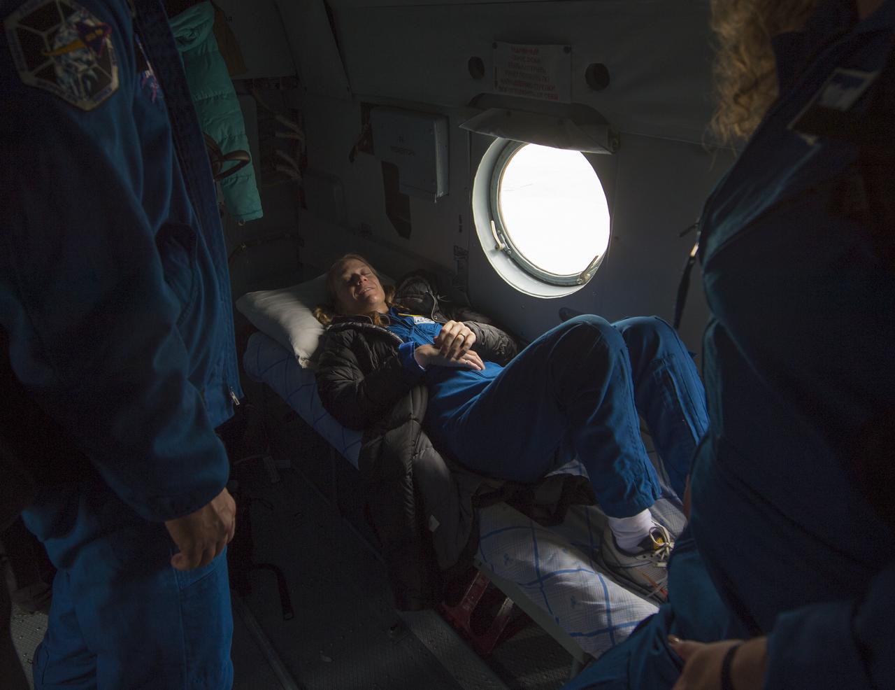 Expedition 37 NASA Flight Engineer Karen Nyberg rests on the helicopter ride to Karaganda, Kazakhstan after her landing in the Soyuz TMA-09M spacecraft in a remote area southeast of the town of Zhezkazgan, Monday, Nov. 11, 2013.  Nyberg, Expedition 37 Commander Fyodor Yurchikhin of the Russian Federal Space Agency (Roscosmos) and Italian Flight Engineer Luca Parmitano returned to earth after five and a half months on the International Space Station. Photo Credit: (NASA/Carla Cioffi)