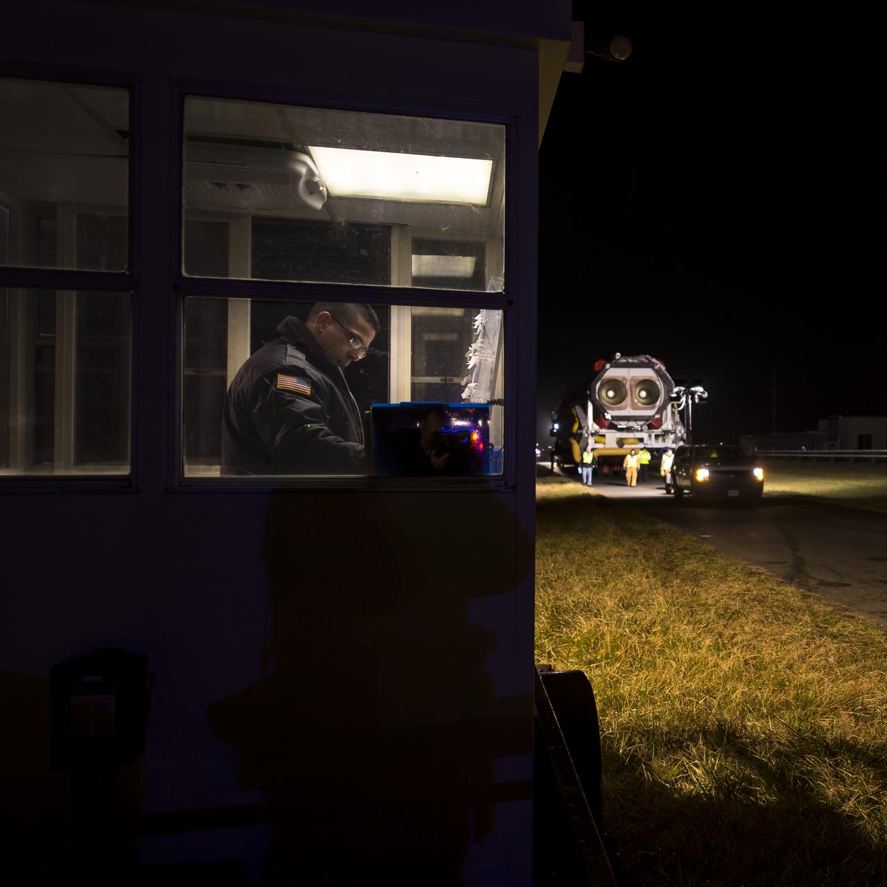 An Orbital Science Corporation Antares rocket is seen as it is rolled out to launch Pad-0A at NASA's Wallops Flight Facility Tuesday, December 17, 2013 in advance of a Thursday launch, Wallops Island, VA. The Antares will launch a Cygnus spacecraft on a cargo resupply mission to the International Space Station. The Orbital-1 mission is Orbital Sciences' first contracted cargo delivery flight to the space station for NASA. Among the cargo aboard Cygnus set to launch to the space station are science experiments, crew provisions, spare parts and other hardware. Launch is scheduled for 9:19 p.m. EST on Thursday, Dec. 19. Weather permitting, it may be widely visible along the east coast of the United States. Photo Credit: (NASA/Bill Ingalls)