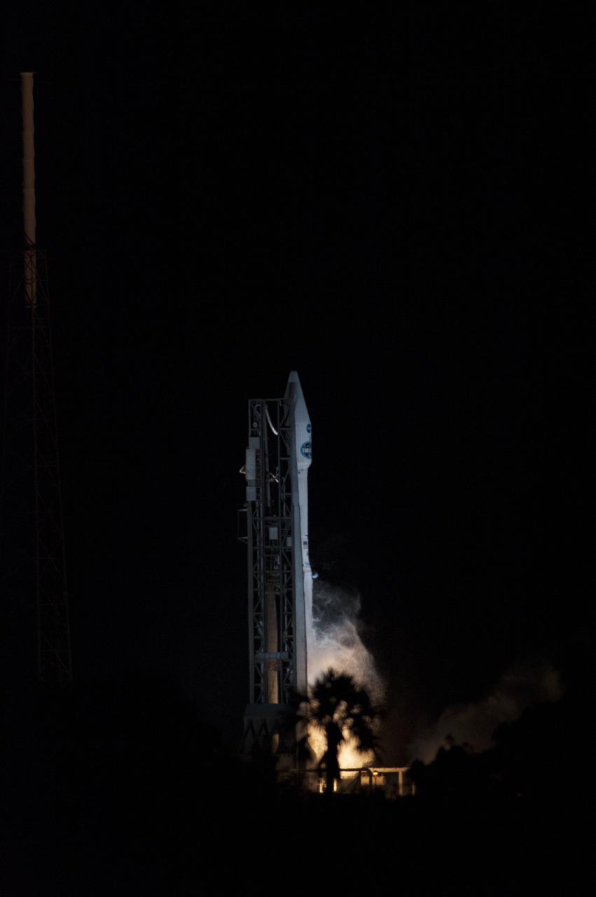 CAPE CANAVERAL, Fla. -- Engine ignition beneath a United Launch Alliance Atlas V is backfor a palm tree at Space Launch Complex 41 on Cape Canaveral Air Force Station in Florida, as the rocket lifts off carrying NASA's Tracking and Data Relay Satellite, or TDRS-L, to Earth orbit. Launch was at 9:33 p.m. EST Jan. 23 during a 40-minute launch window. The TDRS-L spacecraft is the second of three new satellites designed to ensure vital operational continuity for NASA by expanding the lifespan of the Tracking and Data Relay Satellite System TDRSS fleet, which consists of eight satellites in geosynchronous orbit. The spacecraft provide tracking, telemetry, command and high-bandwidth data return services for numerous science and human exploration missions orbiting Earth. These include NASA's Hubble Space Telescope and the International Space Station. TDRS-L has a high-performance solar panel designed for more spacecraft power to meet the growing S-band communications requirements. TDRSS is one of three NASA Space Communication and Navigation SCaN networks providing space communications to NASA’s missions. For more information more about TDRS-L, visit http:__www.nasa.gov_tdrs. To learn more about SCaN, visit www.nasa.gov_scan. Photo credit: NASA_Kevin O'Connell