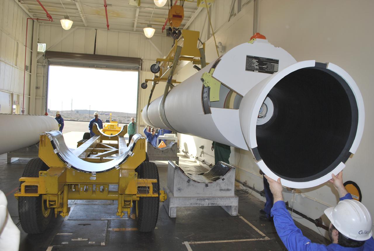 VANDENBERG AIR FORCE BASE, Calif. – Workers at Vandenberg Air Force Base in California lower a solid rocket motor, or SRM, for NASA's Orbiting Carbon Observatory-2, the OCO-2 mission, onto a storage chock where it will be kept until needed. The SRMs will be attached to a United Launch Alliance Delta II rocket slated to launch the OCO-2 spacecraft from Space Launch Complex 2 in July. OCO-2 will collect precise global measurements of carbon dioxide in the Earth's atmosphere and provide scientists with a better idea of the chemical compound's impacts on climate change. Scientists will analyze this data to improve our understanding of the natural processes and human activities that regulate the abundance and distribution of this important atmospheric gas. Photo credit: NASA_Randy Beaudoin