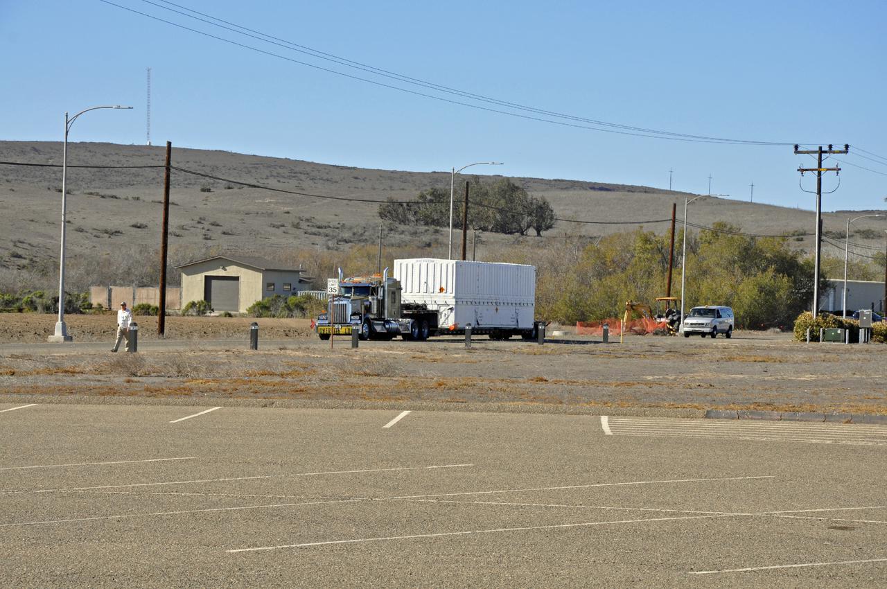 VANDENBERG AIR FORCE BASE, Calif. – The fairing for NASA's Orbiting Carbon Observatory-2, or OCO-2, mission arrives at Vandenberg Air Force Base in California.   The fairing will protect OCO-2 during launch aboard a United Launch Alliance Delta II rocket from Space Launch Complex 2 in July. OCO-2 will collect precise global measurements of carbon dioxide in the Earth's atmosphere and provide scientists with a better idea of the chemical compound's impacts on climate change. Scientists will analyze this data to improve our understanding of the natural processes and human activities that regulate the abundance and distribution of this important atmospheric gas. Photo credit: NASA_Randy Beaudoin