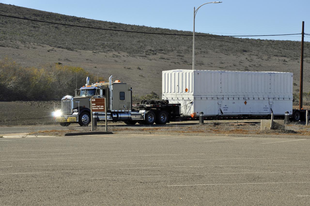 VANDENBERG AIR FORCE BASE, Calif. – The fairing for NASA's Orbiting Carbon Observatory-2, or OCO-2, mission arrives at Vandenberg Air Force Base in California.   The fairing will protect OCO-2 during launch aboard a United Launch Alliance Delta II rocket from Space Launch Complex 2 in July. OCO-2 will collect precise global measurements of carbon dioxide in the Earth's atmosphere and provide scientists with a better idea of the chemical compound's impacts on climate change. Scientists will analyze this data to improve our understanding of the natural processes and human activities that regulate the abundance and distribution of this important atmospheric gas. Photo credit: NASA_Randy Beaudoin