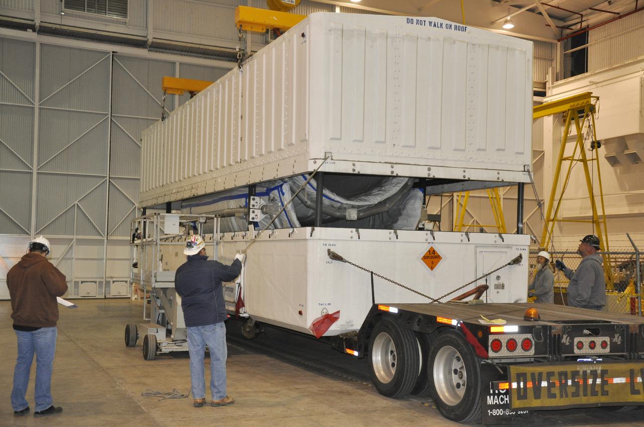 VANDENBERG AIR FORCE BASE, Calif. – The shipping container transporting the fairing for NASA's Orbiting Carbon Observatory-2 mission, or OCO-2, is delivered into the NASA Building 836 high bay at Vandenberg Air Force Base in California.    The fairing will protect OCO-2 during launch aboard a United Launch Alliance Delta II rocket from Space Launch Complex 2 in July. OCO-2 will collect precise global measurements of carbon dioxide in the Earth's atmosphere and provide scientists with a better idea of the chemical compound's impacts on climate change. Scientists will analyze this data to improve our understanding of the natural processes and human activities that regulate the abundance and distribution of this important atmospheric gas. To learn more about OCO-2, visit http:__oco.jpl.nasa.gov.  Photo credit: NASA_Randy Beaudoin