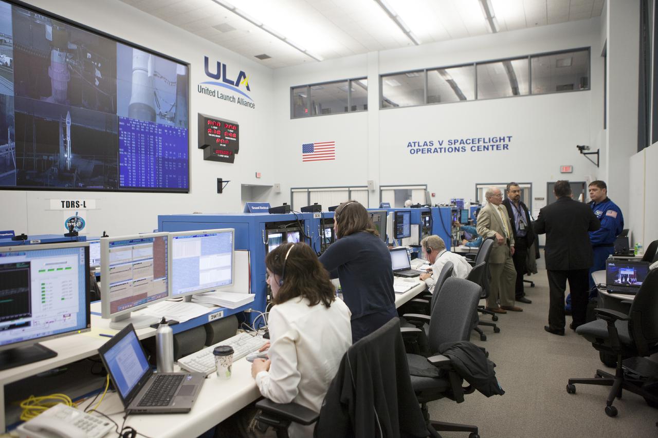 CAPE CANAVERAL, Fla. – At Cape Canaveral Air Force Station's Atlas V Spaceflight Operations Center NASA and contractor managers and engineers monitor progress of the countdown for the launch the agency's Tracking and Data Relay Satellite, or TDRS-L, spacecraft atop a United Launch Alliance Atlas V rocket. The TDRS-L spacecraft is the second of three new satellites designed to ensure vital operational continuity for NASA by expanding the lifespan of the Tracking and Data Relay Satellite System TDRSS fleet, which consists of eight satellites in geosynchronous orbit. The spacecraft provide tracking, telemetry, command and high bandwidth data return services for numerous science and human exploration missions orbiting Earth. These include NASA's Hubble Space Telescope and the International Space Station. TDRS-L has a high-performance solar panel designed for more spacecraft power to meet the growing S-band communications requirements. TDRSS is one of NASA Space Communication and Navigation’s SCaN three networks providing space communications to NASA’s missions. For more information more about TDRS-L, visit: http:__www.nasa.gov_tdrs To learn more about SCaN, visit: www.nasa.gov_scan Photo credit: NASA_Kim Shiflett