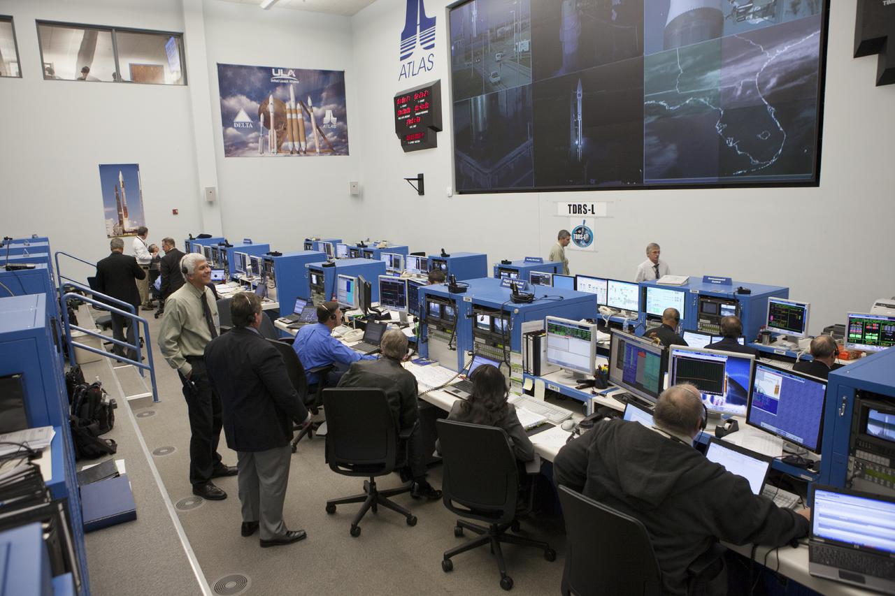 CAPE CANAVERAL, Fla. – At Cape Canaveral Air Force Station's Atlas V Spaceflight Operations Center NASA and contractor managers and engineers monitor progress of the countdown for the launch the agency's Tracking and Data Relay Satellite, or TDRS-L, spacecraft atop a United Launch Alliance Atlas V rocket. The TDRS-L spacecraft is the second of three new satellites designed to ensure vital operational continuity for NASA by expanding the lifespan of the Tracking and Data Relay Satellite System TDRSS fleet, which consists of eight satellites in geosynchronous orbit. The spacecraft provide tracking, telemetry, command and high bandwidth data return services for numerous science and human exploration missions orbiting Earth. These include NASA's Hubble Space Telescope and the International Space Station. TDRS-L has a high-performance solar panel designed for more spacecraft power to meet the growing S-band communications requirements. TDRSS is one of NASA Space Communication and Navigation’s SCaN three networks providing space communications to NASA’s missions. For more information more about TDRS-L, visit: http:__www.nasa.gov_tdrs To learn more about SCaN, visit: www.nasa.gov_scan Photo credit: NASA_Kim Shiflett