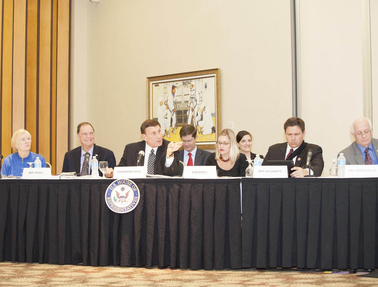 CAPE CANAVERAL, Fla. – At the Kurt H. Debus Conference Facility at the Kennedy Space Center Visitor Complex, Rep. John Mica, R-Fla., center, speaks to witnesses during a hearing of the U.S. House of Representatives' Subcommittee on Government Operations. From the left are Rep. Candace Miller, R-Mich., Rep. Bill Posey, R-Fla., Mica, the counsel for Rep. Mica, Rep. Ron Desantis, R-Fla., and Rep. Kerry Bentivollo, R-Mich.   The Congressional hearing took place to review plans for putting vacant buildings and excess property at the Kennedy Space Center to their best and most productive use. Photo credit: NASA_Daniel Casper