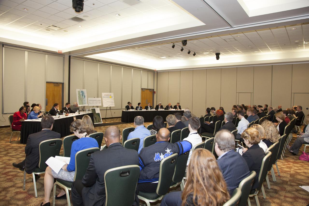 CAPE CANAVERAL, Fla. – At the Kurt H. Debus Conference Facility at the Kennedy Space Center Visitor Complex, guests listen to a hearing of the U.S. House of Representatives' Subcommittee on Government Operations.   The Congressional hearing took place to review plans for putting vacant buildings and excess property at the Kennedy Space Center to their best and most productive use. Photo credit: NASA_Daniel Casper