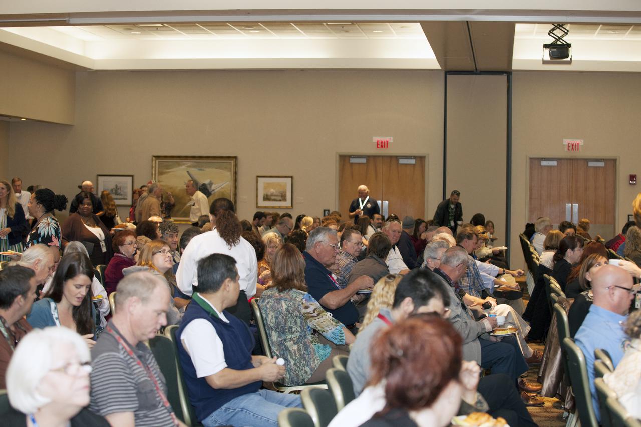 CAPE CANAVERAL, Fla. – NASA Kennedy Space Center volunteers fill the Debus Conference Facility at the Kennedy Space Center Visitor Complex in Florida for a KSC Volunteer Appreciation Event.  The group was given a briefing by Kennedy Associate Director Kelvin Manning on future prospects for the space center, entitled 'Pushing the Boundaries.' To learn about NASA's Speakers Bureau, visit http:__speakers.grc.nasa.gov_speaker. Photo credit: NASA_Daniel Casper