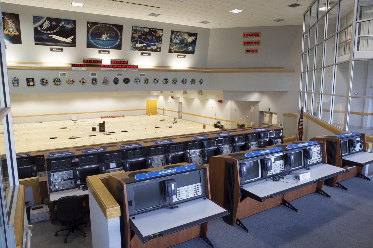 CAPE CANAVERAL, Fla. – In Firing Room 4 in the Launch Control Center at NASA’s Kennedy Space Center in Florida, the legacy consoles, Launch Processing System and cabling that once supported the Space Shuttle Program have been removed. The Ground Systems Development and Operations Program is overseeing the construction in progress on a multi-use control room that will support NASA and commercial launch needs.  The design of Firing Room 4 will incorporate five control room areas that are flexible to meet current and future user requirements. The equipment and consoles from Firing Room 4 are being moved to Firing Room 2 for possible future reuse. Photo credit: NASA_Dimitri Gerondidakis