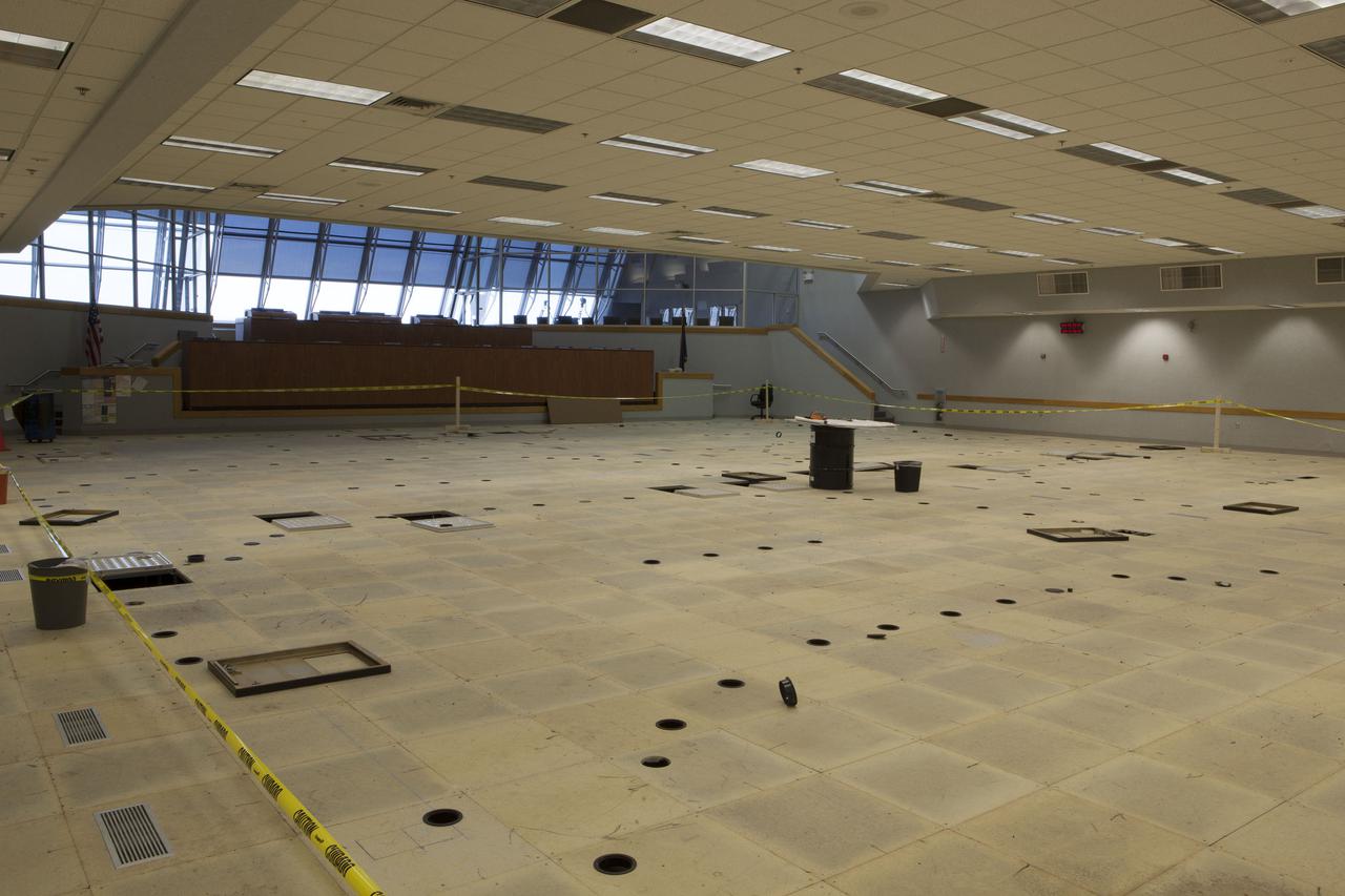 CAPE CANAVERAL, Fla. – In Firing Room 4 in the Launch Control Center at NASA’s Kennedy Space Center in Florida, the legacy consoles, Launch Processing System and cabling that once supported the Space Shuttle Program have been removed. The Ground Systems Development and Operations Program is overseeing the construction in progress on a multi-use control room that will support NASA and commercial launch needs.  The design of Firing Room 4 will incorporate five control room areas that are flexible to meet current and future user requirements. The equipment and consoles from Firing Room 4 are being moved to Firing Room 2 for possible future reuse. Photo credit: NASA_Dimitri Gerondidakis