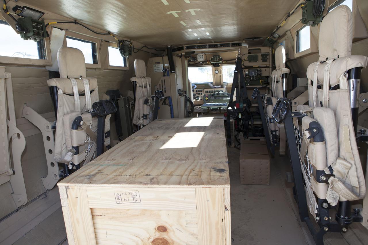 CAPE CANAVERAL, Fla. – A view of the interior of one of four new emergency egress vehicles, called Mine-Resistant Ambush-Protected, or MRAP, vehicles is shown. The MRAPs are at the Maintenance and Operations Facility at NASA’s Kennedy Space Center in Florida. The MRAPs arrived from the U.S. Army Red River Depot in Texarkana, Texas in December 2013. The vehicles were processed in and then transported to the Rotation, Processing and Surge Facility near the Vehicle Assembly Building for temporary storage. The Ground Systems Development and Operations Program at Kennedy led the efforts to an emergency egress vehicle that future astronauts could quickly use to leave the Launch Complex 39 area in case of an emergency. During crewed launches of NASA’s Space Launch System and Orion spacecraft, the MRAP will be stationed by the slidewire termination area at the pad. In case of an emergency, the crew will ride a slidewire to the ground and immediately board the MRAP for safe egress from the pad. The new vehicles replace the M-113 vehicles that were used during the Space Shuttle Program. Photo credit: NASA_Kim Shiflett