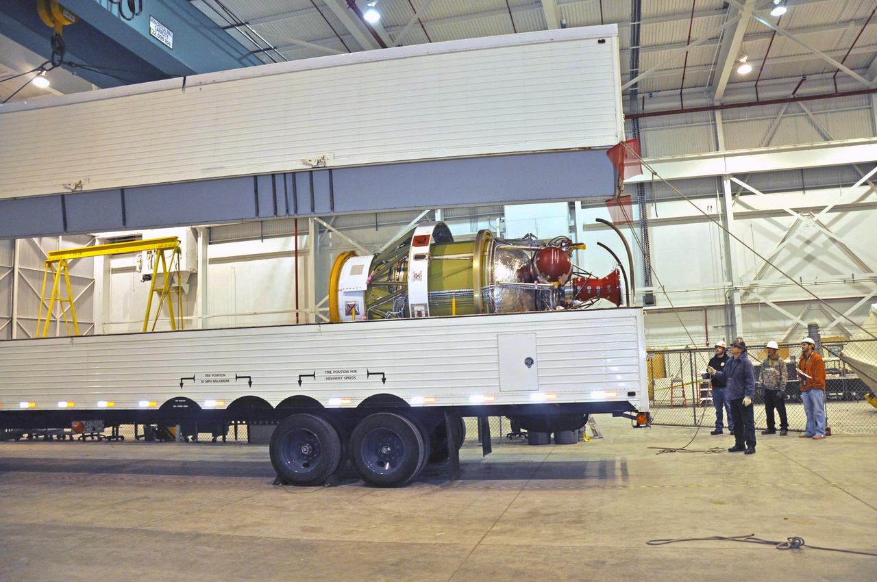 VANDENBERG AIR FORCE BASE, Calif. – As the cover of the transportation trailer is lifted in the high bay of the Building 836 hangar on Vandenberg Air Force Base in California, the second stage for NASA's Orbiting Carbon Observatory-2 mission, or OCO-2, comes into view.  OCO-2 is scheduled to launch aboard a United Launch Alliance Delta II rocket from Space Launch Complex 2 in July. The rocket's second stage will insert OCO-2 into a polar Earth orbit.  OCO-2 will collect precise global measurements of carbon dioxide in the Earth's atmosphere and provide scientists with a better idea of the chemical compound's impacts on climate change. Scientists will analyze this data to improve our understanding of the natural processes and human activities that regulate the abundance and distribution of this important atmospheric gas. To learn more about OCO-2, visit http:__oco.jpl.nasa.gov. Photo credit: NASA_Randy Beaudoin