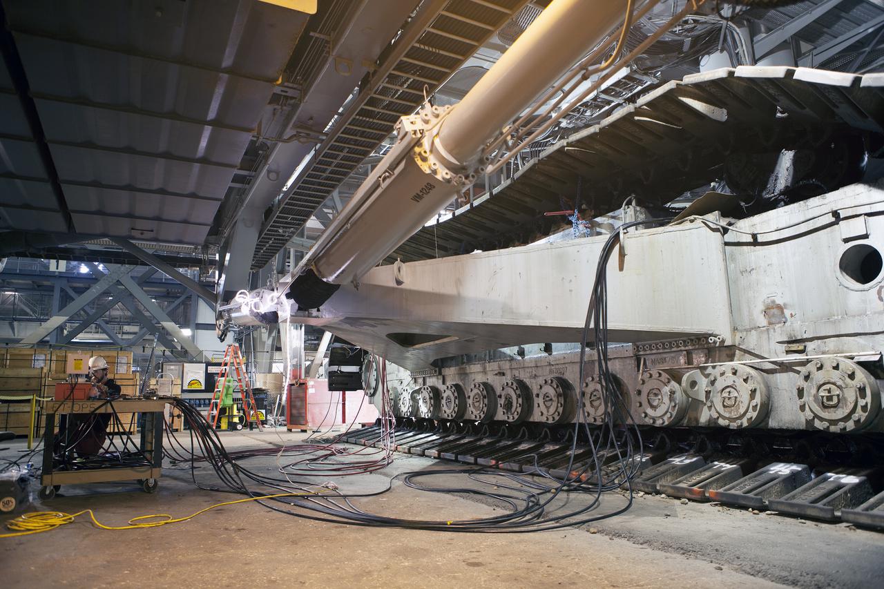 CAPE CANAVERAL, Fla. – Inside the Vehicle Assembly Building at NASA’s Kennedy Space Center in Florida, the B and D truck sections of crawler-transporter 2, or CT-2, are being raised up to prepare for installation of new roller bearing assemblies.   Work continues in high bay 2 to upgrade CT-2. The modifications are designed to ensure CT-2’s ability to transport launch vehicles currently in development, such as the agency’s Space Launch System, to the launch pad. The Ground Systems Development and Operations Program office at Kennedy is overseeing the upgrades. For more than 45 years the crawler-transporters were used to transport the mobile launcher platform and the Apollo-Saturn V rockets and, later, space shuttles to Launch Pads 39A and B. For more information, visit: http:__www.nasa.gov_exploration_systems_ground_crawler-transporter. Photo credit: NASA_Dimitri Gerondidakis