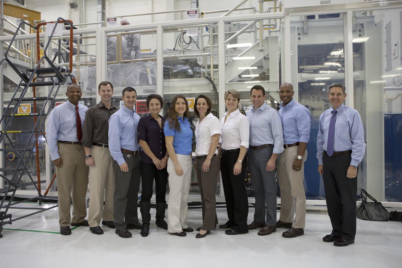 CAPE CANAVERAL, Fla. -- In the Operations and Checkout Building of NASA's Kennedy Space Center in Florida, astronaut candidates pose with spaceport leaders who briefed them on operations to prepare the Orion spacecraft for Exploration Flight Test EFT-1. Plans call for the Lockheed Martin-built Orion to launch atop a United Launch Alliance Delta IV Heavy rocket from Cape Canaveral Air Force Station. From the left are associate center director Kelvin Manning, Tyler Nick Hague, Andrew Morgan, Jessica Meir, Christina Hammock, Nicole Mann, Anne McClain, Josh Cassada, Victor Glover and center director Bob Cabana. The astronaut class of 2013 was selected by NASA after an extensive year-and-a-half search. The new group will help the agency push the boundaries of exploration and travel to new destinations in the solar system. To learn more about the astronaut class of 2013, visit: http:__www.nasa.gov_astronauts_2013astroclass.html Photo credit: NASA_Kim Shiflett
